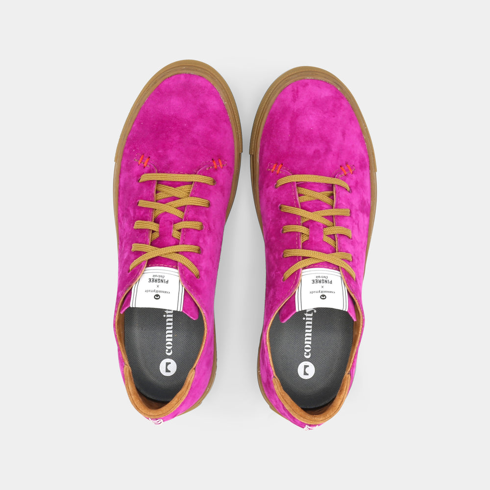 
                      
                        A pink low-top sneaker with a brown sole and laces, top view.
                      
                    