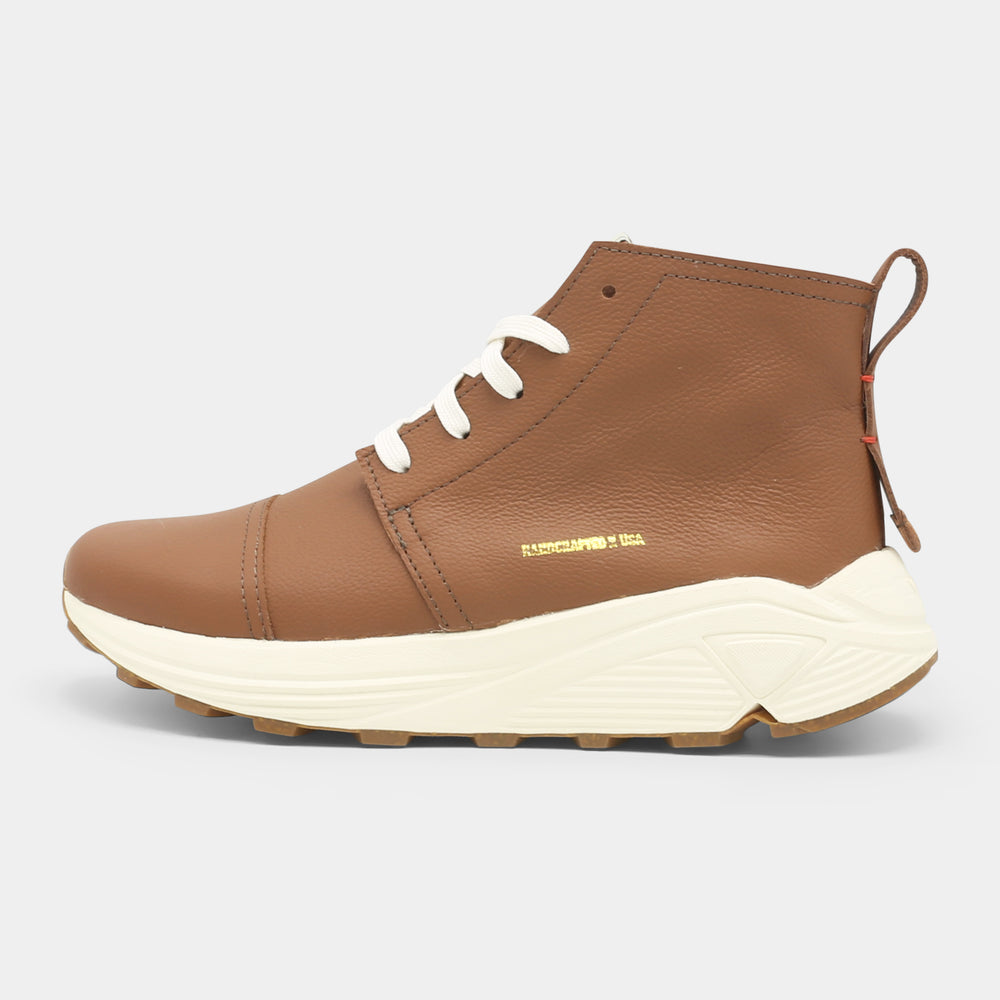 A brown high-top urban utility chukka boot with white laces and a chunky white sole lateral view.
