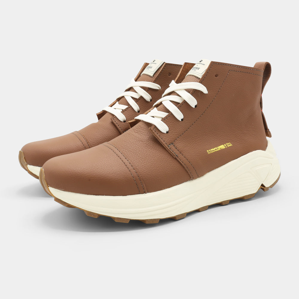 A brown high-top urban utility chukka boot with white laces and a chunky white sole lateral view.