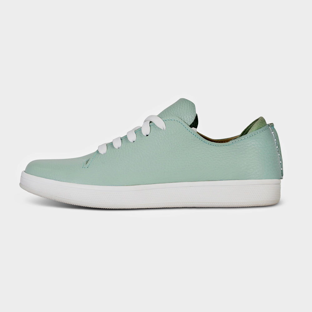 
                      
                        A profile shot of single light green leather sneaker with a lace-up closure, featuring flat white shoelaces, a white rubber cupsole and a green accent on the heel.
                      
                    