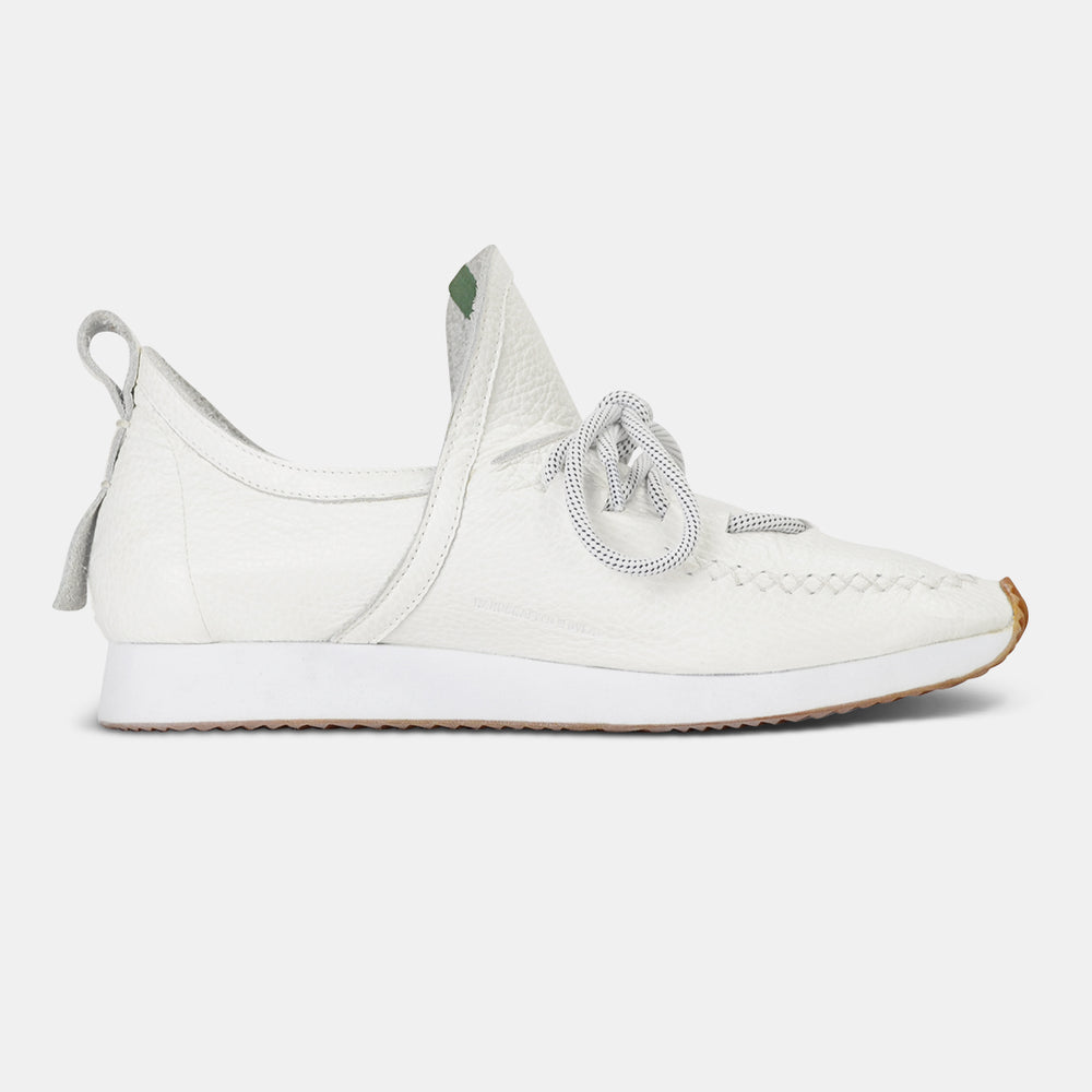 
                      
                        A single profile medial shot of a casual white leather mid-cut slip-on shoe with unique stitch detailing on the toe.  Round white laces with heel loop pull tab and a white midsole and rubber outsole.
                      
                    