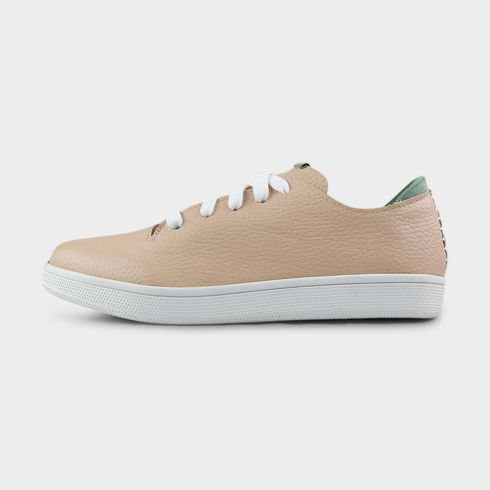 
                      
                        A profile shot of single nude beige leather sneaker with a lace-up closure, featuring flat white shoelaces, a white rubber cupsole and a green accent on the heel.
                      
                    