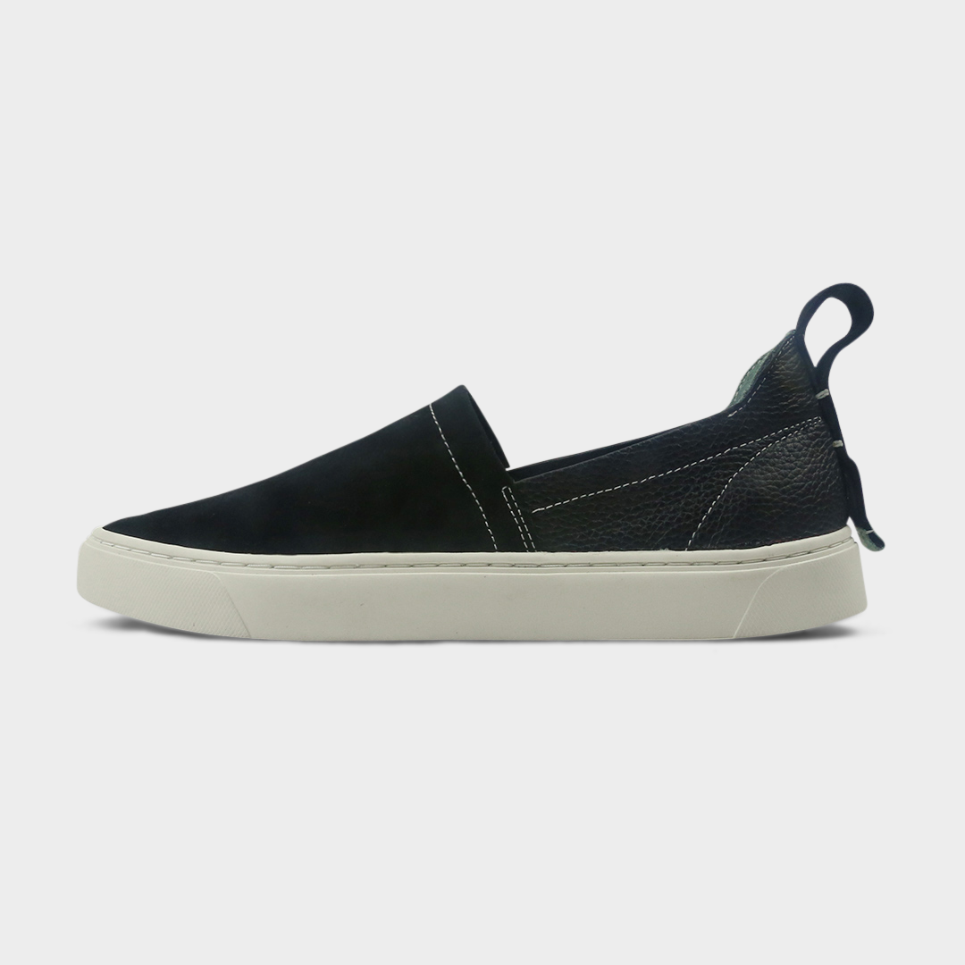 A black slip-on men's shoe with a suede and leather upper and a rubber sole lateral view