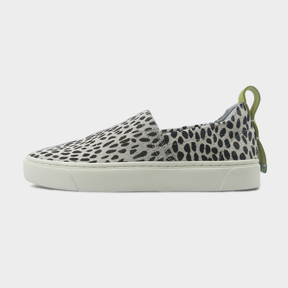A cheetah slip-on women's shoe with a suede and manmade material upper and a rubber sole lateral view