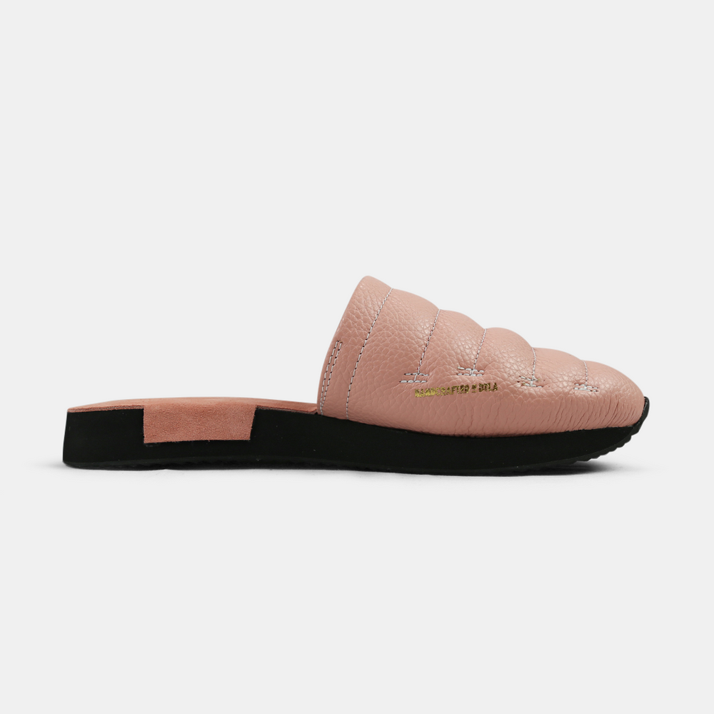 
                      
                        A men's Mateo slipper in pink with a black rubber outsole, featuring a quilted design and a metallic accent medial view
                      
                    
