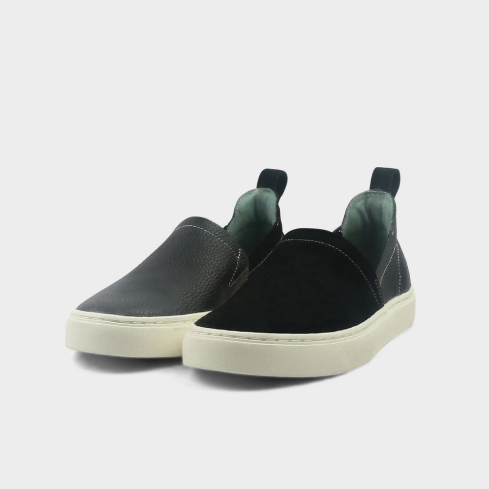 A black slip-on men's shoe with a suede and leather upper and a rubber sole quarter view