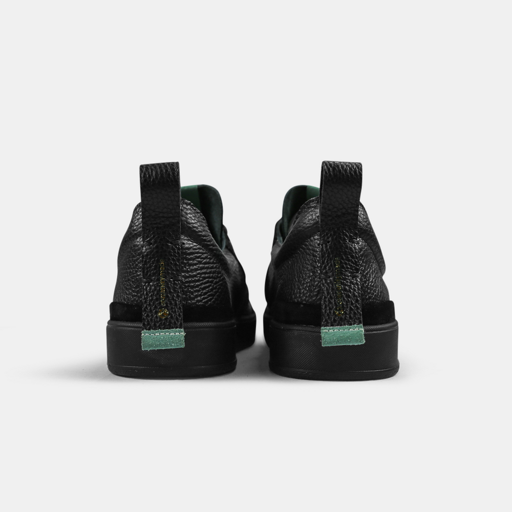 
                      
                        A black men's sneaker with a lace-up closure, made from Italian leather, with a rubber cupsole back view
                      
                    