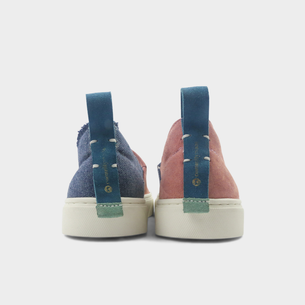 
                      
                        A pink and blue slip-on men's shoe with a suede and manmade material upper and a rubber sole back view
                      
                    