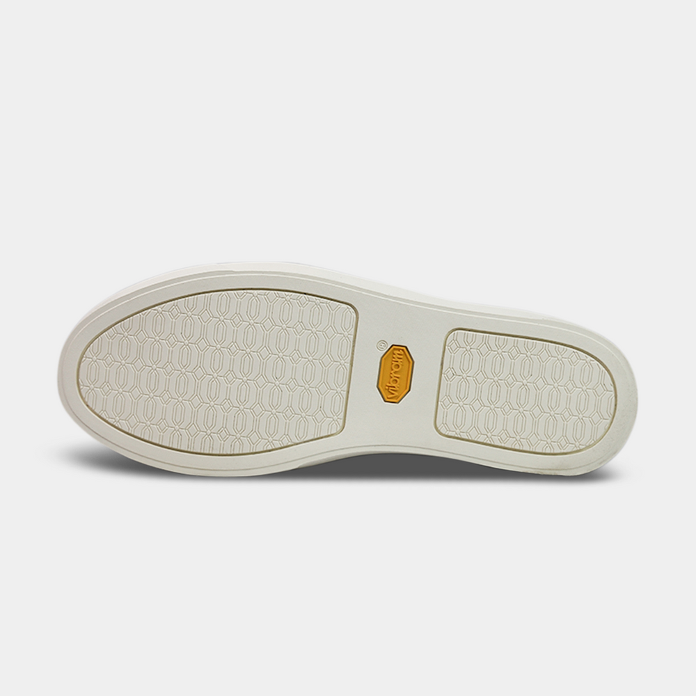 
                      
                        White vibram outsole with yellow Vibram logo in the center
                      
                    