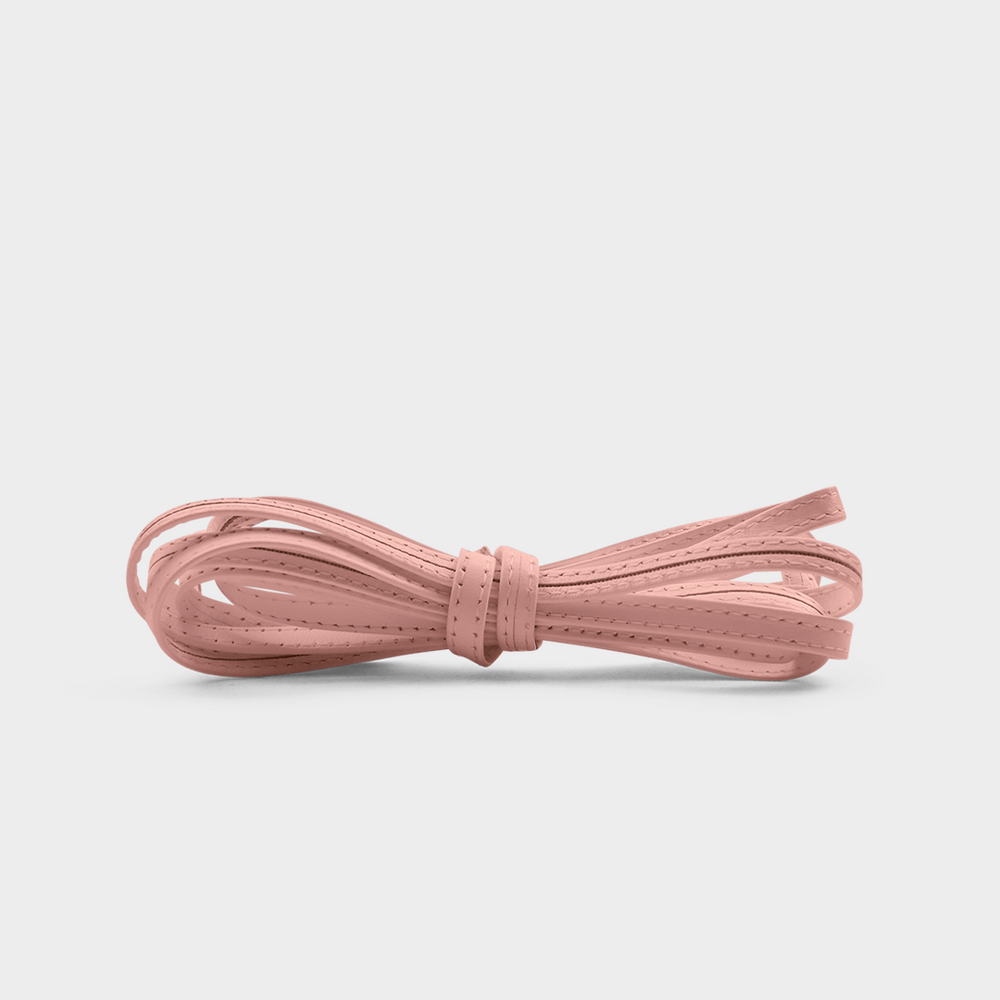 
                      
                        A pink leather lace tied in a knot
                      
                    