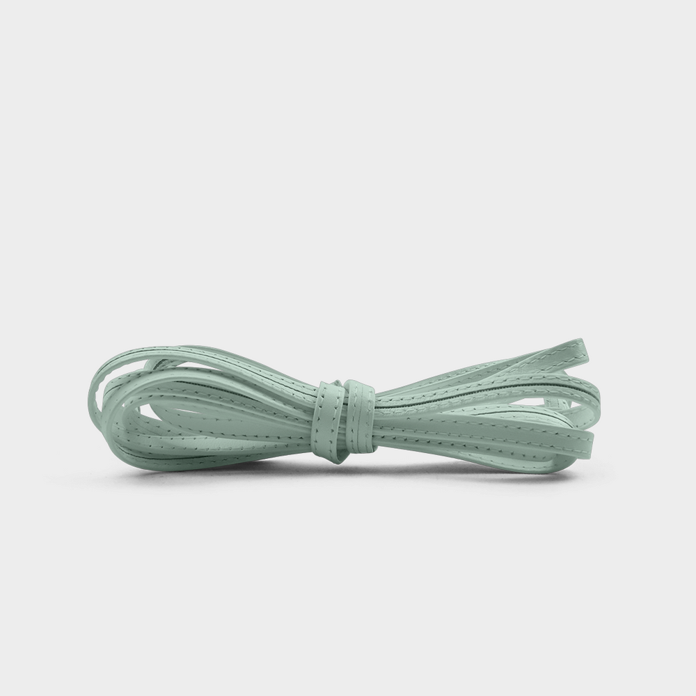 
                      
                        A seafoam leather lace tied in a knot.
                      
                    