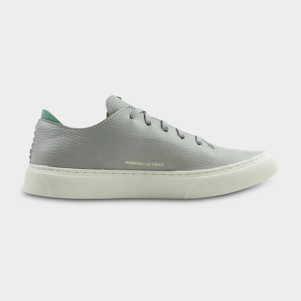 
                      
                        A women's sneaker in grey color, made of Italian full grain leather, with a lace-up closure medial view
                      
                    