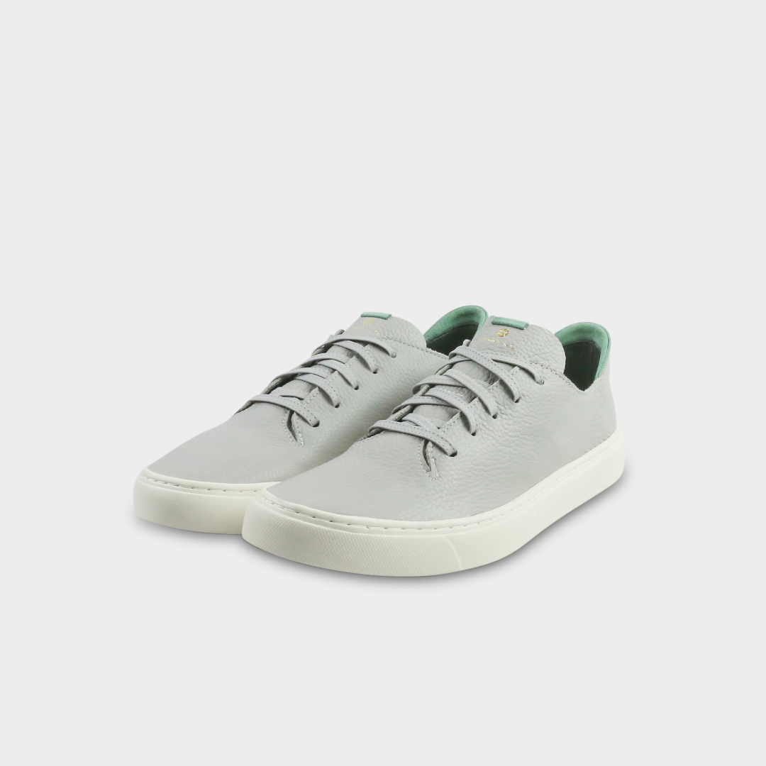A gray men's sneaker with a lace-up closure made with Italian full grain leather, featuring a rubber cupsole quarter view