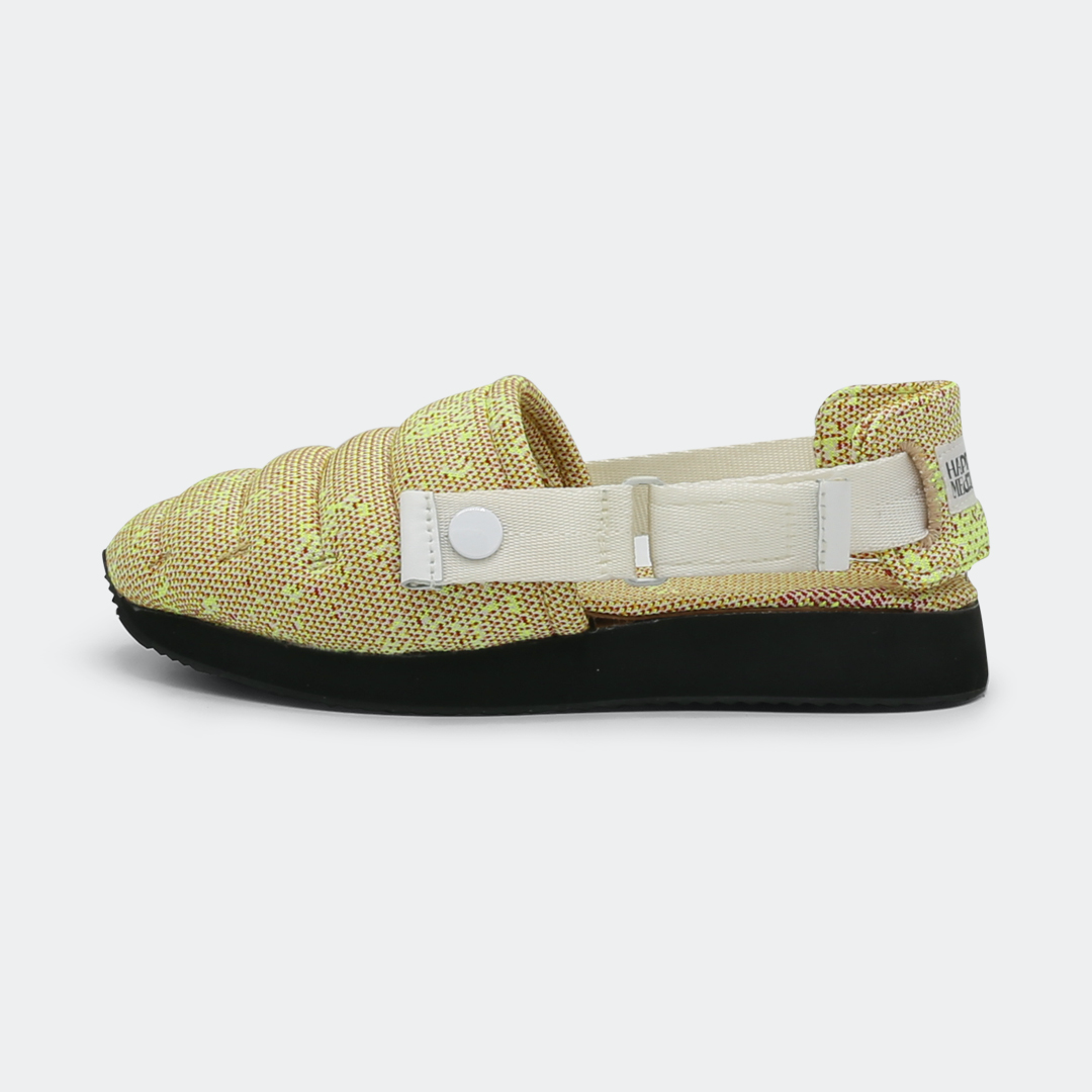 Slipper with a yellow and pink knit upper, an adjustable white strap, and a black rubber outsole lateral view