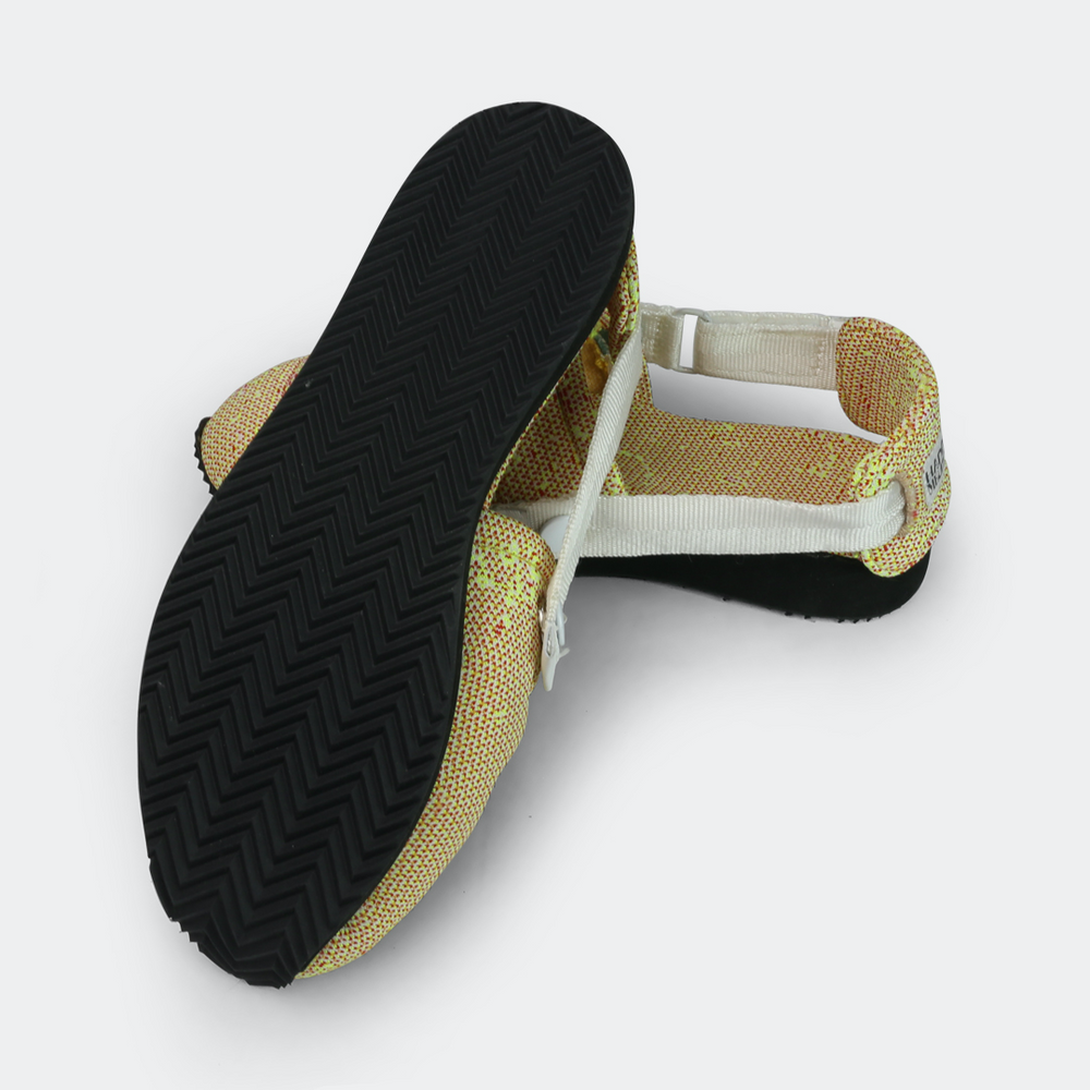 
                      
                        Mateo Slippers with a happy medium branding, featuring a herringbone pattern on the outsole and an adjustable strap outsole view
                      
                    
