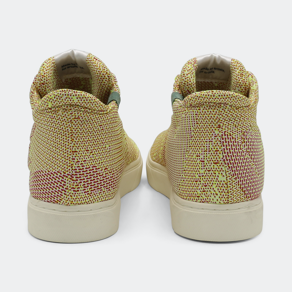 
                      
                        Mid-top sneakers with a camouflage pattern in yellow and pink colors, featuring lace-up closure back view
                      
                    