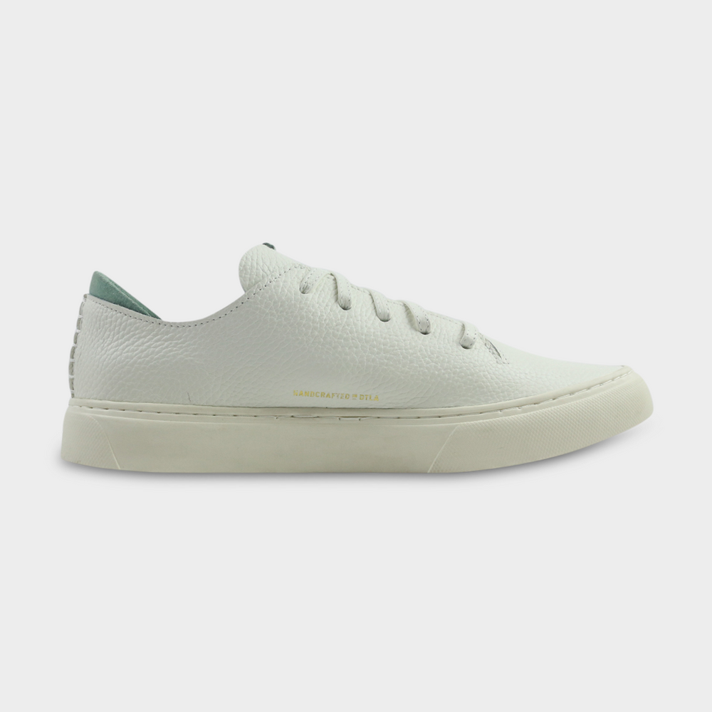 
                      
                        A women's sneaker in off-white color, made of Italian full grain leather, with a lace-up closure medial view
                      
                    